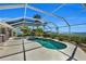 Relaxing kidney-shaped pool and spa with water view at 12440 Placida Rd, Placida, FL 33946