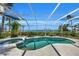 Spacious pool and spa with a screened enclosure at 12440 Placida Rd, Placida, FL 33946