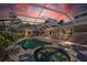 Inviting pool and spa with covered patio area at 12440 Placida Rd, Placida, FL 33946