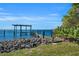 Expansive waterfront views with private dock and lush landscaping at 12440 Placida Rd, Placida, FL 33946