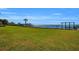 Expansive waterfront property with a grassy area and private dock at 12440 Placida Rd, Placida, FL 33946