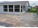 The back patio has an attached Florida room addition with a colorful, brick paver patio at 13525 Dibella Ave, Port Charlotte, FL 33981