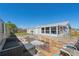 Enjoy outdoor living on this brick paved backyard, complete with seating and an enclosed patio at 13525 Dibella Ave, Port Charlotte, FL 33981
