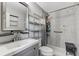 A clean bathroom shows a modern vanity and a shower with tiled walls and grab bars at 13525 Dibella Ave, Port Charlotte, FL 33981