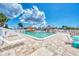 Relaxing community pool with plenty of lounge chairs at 13525 Dibella Ave, Port Charlotte, FL 33981