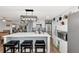 Modern kitchen with stainless steel appliances, island with breakfast bar, and stylish pendant lighting at 13525 Dibella Ave, Port Charlotte, FL 33981