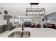 Bright, airy kitchen featuring a quartz countertop island with seating and views into the living room at 13525 Dibella Ave, Port Charlotte, FL 33981