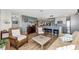 Living room with a transitional design seamlessly connects to an updated kitchen at 13525 Dibella Ave, Port Charlotte, FL 33981