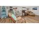 Relaxing living room featuring comfortable seating, beach-themed decor, and a cozy atmosphere at 13525 Dibella Ave, Port Charlotte, FL 33981