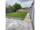 Backyard patio with pavers and a grassy area at 13525 Dibella Ave, Port Charlotte, FL 33981