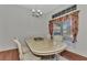 Elegant dining room with a large table and chandelier at 2341 Rio De Janeiro Ave, Punta Gorda, FL 33983