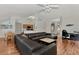 Living room with sectional sofa, hardwood floors and views into kitchen and dining areas at 2341 Rio De Janeiro Ave, Punta Gorda, FL 33983