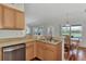 Kitchen features stainless steel appliances and light wood cabinets at 2341 Rio De Janeiro Ave, Punta Gorda, FL 33983