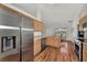 Modern kitchen with stainless steel appliances and light wood cabinets at 2341 Rio De Janeiro Ave, Punta Gorda, FL 33983