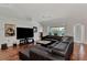 Spacious living room featuring a large sectional sofa and hardwood floors at 2341 Rio De Janeiro Ave, Punta Gorda, FL 33983