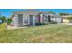 Single-story house with gray siding and manicured lawn at 2341 Rio De Janeiro Ave, Punta Gorda, FL 33983