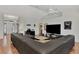 Spacious living room featuring a large sectional sofa and TV at 2341 Rio De Janeiro Ave, Punta Gorda, FL 33983