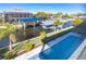 Stunning view of a canal with boats and lush landscaping from a private balcony at 10476 Sherman St, Englewood, FL 34224