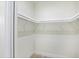 Bright walk-in closet with white shelving at 8343 Olsen St, Port Charlotte, FL 33981
