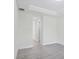 Empty bedroom with grey tile floors and white walls at 8343 Olsen St, Port Charlotte, FL 33981