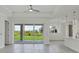 Open concept living area with view of backyard through sliding glass doors at 8343 Olsen St, Port Charlotte, FL 33981
