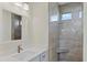 Bathroom with a walk-in shower and modern vanity at 8343 Olsen St, Port Charlotte, FL 33981