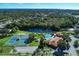 Community overview featuring pool, tennis courts, and lake at 584 Gadsen St, Englewood, FL 34223