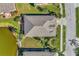Home's roofline and backyard from above at 584 Gadsen St, Englewood, FL 34223