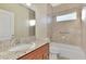 Bathroom with granite countertop and bathtub at 584 Gadsen St, Englewood, FL 34223
