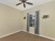 Bedroom with carpet, ceiling fan and lake view at 584 Gadsen St, Englewood, FL 34223
