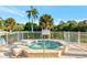 Relaxing community hot tub with surrounding fence at 584 Gadsen St, Englewood, FL 34223