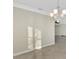 Bright dining room with tile floors and chandelier at 584 Gadsen St, Englewood, FL 34223