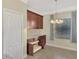 Bright dining area featuring built-in cabinetry, granite countertops, and ample natural light at 584 Gadsen St, Englewood, FL 34223