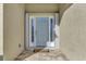 Front entry with light-blue door, sidelights, and a brick walkway at 584 Gadsen St, Englewood, FL 34223