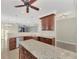 Granite kitchen island and ample wood cabinetry at 584 Gadsen St, Englewood, FL 34223