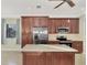 Island kitchen with stainless steel appliances and granite countertops at 584 Gadsen St, Englewood, FL 34223