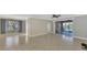 Living area with tile floors and access to the patio at 584 Gadsen St, Englewood, FL 34223