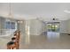 Spacious living room with tile floors and access to backyard at 584 Gadsen St, Englewood, FL 34223