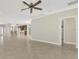Open living room with views into kitchen and tile floors at 584 Gadsen St, Englewood, FL 34223