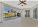 Large screened porch with view of the lake and homes at 584 Gadsen St, Englewood, FL 34223
