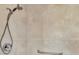 Walk-in shower with neutral tile and grab bar at 584 Gadsen St, Englewood, FL 34223