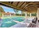 Community shuffleboard courts under covered pavilion at 584 Gadsen St, Englewood, FL 34223