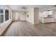 Open floor plan living room and kitchen with hardwood floors at 76 Caddy Rd, Rotonda West, FL 33947