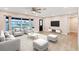 Living room with light flooring, neutral walls, and ample natural light at 76 Caddy Rd, Rotonda West, FL 33947