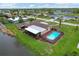 Ranch-style home with private pool and canal access at 76 Caddy Rd, Rotonda West, FL 33947
