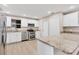 Updated kitchen, featuring stainless steel appliances and granite countertops at 76 Caddy Rd, Rotonda West, FL 33947