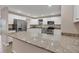 Modern kitchen with granite countertops and stainless steel appliances at 76 Caddy Rd, Rotonda West, FL 33947