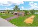Bird's eye view of house, landscaping, and driveway at 76 Caddy Rd, Rotonda West, FL 33947