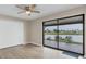 Bright bedroom with water view and sliding glass doors to patio at 76 Caddy Rd, Rotonda West, FL 33947