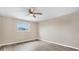 Simple bedroom with a window and ceiling fan at 76 Caddy Rd, Rotonda West, FL 33947